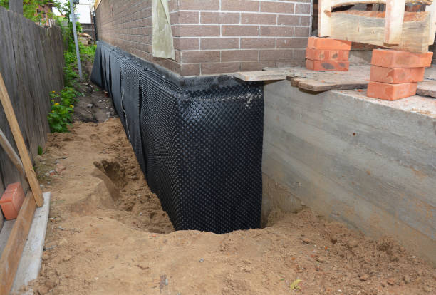 Happy homeowners after waterproofing job in Thornton